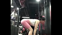 Pink legging with thong doing deadlift